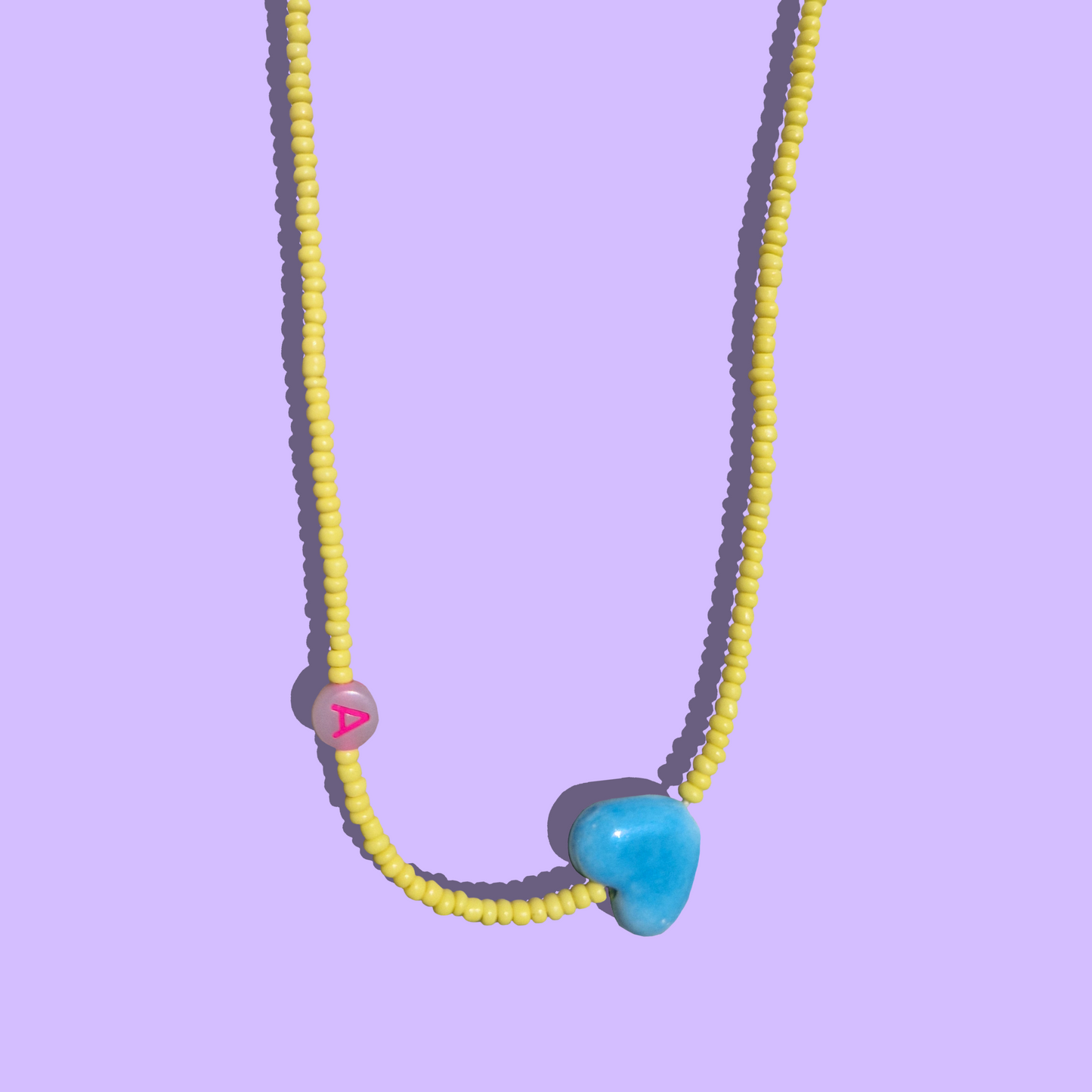 Custom Χειροποίητο Κολιέ από Κίτρινες Χάντρες, Κεραμική Γαλάζια Καρδιά και Φωσφοριζέ Χάντρα με Μονόγραμμα